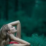 Posture - Woman Wearing Red Sleeveless Dress Standing Near Fern Leaves