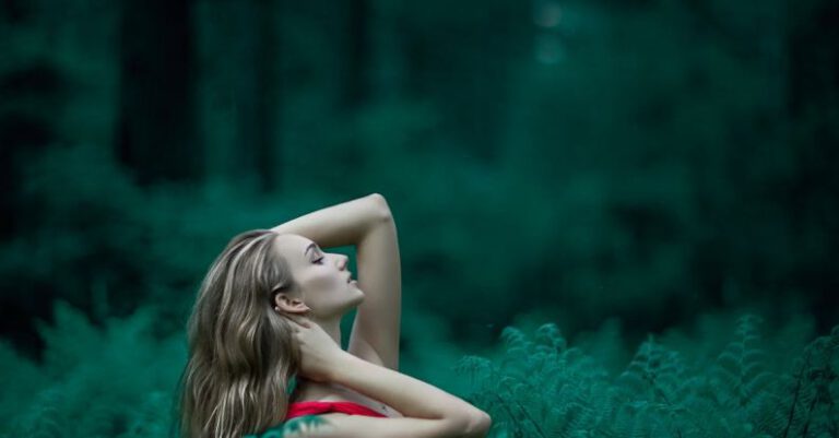 Posture - Woman Wearing Red Sleeveless Dress Standing Near Fern Leaves