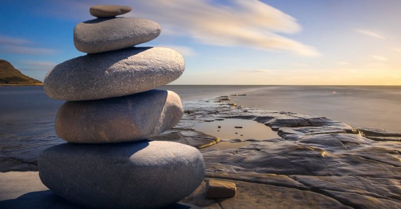 Mindfulness Meditation - Stacked of Stones Outdoors