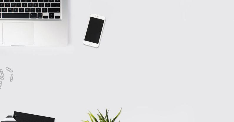 Workspace - White Smartphone Beside Silver Laptop Computer