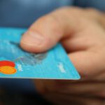 Debt - Person Holding Debit Card