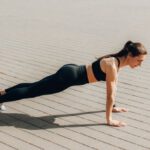 Bodyweight Exercises - A Woman in Activewear Doing a Push Up