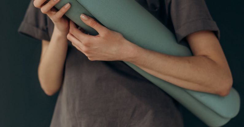 Fitness Routine - Crop Photo Of Woman With Yoga Mat