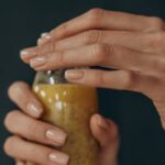 Diet And Exercise - Person Holding Clear Glass Jar With Yellow Liquid