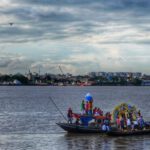 Cultural Immersion - People in Boats Traversing a River