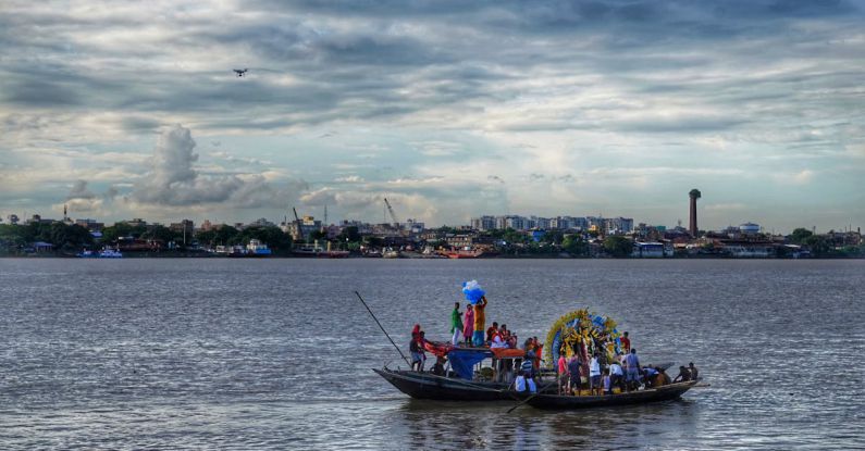 Cultural Immersion - People in Boats Traversing a River